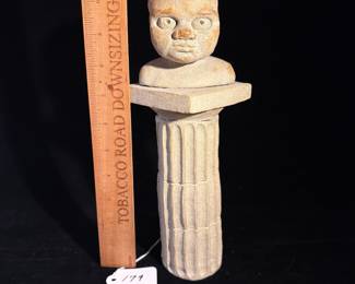 A179 - $125. Baby's Head on Pedestal Sculpture. Measures 3.4" x 11" tall. 