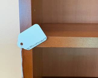 F6 - $40. Single Wooden Bookcase. Adjustable shelves. Measures 31.75” x 11” x 79.5” tall.