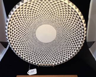 A22 - $125. Leslie Thompson: Black and White Clay Plate. Measures 14.5" diameter. 