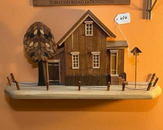 A606 - $65. J. Noto Wooden House Sculpture. Measures 20.25"w x 4.25"d x 10.25" tall