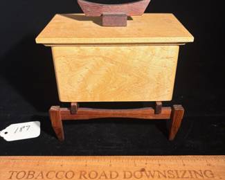 A187 - $40. Will Wipperfurth. Will's Woodworking: Paduk And Maple Box. Measures 6" x 4" x 6.25" tall.