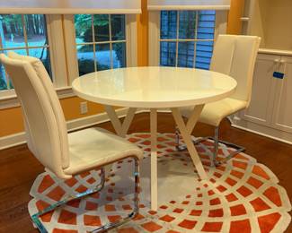 F12 - $195. Crate & Barrel Ypsilon Dining Table. 42" round table x 29.5" tall. Chairs are very worn. Table has been used but is sturdy!
