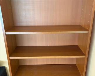 F6 - $40. Single Wooden Bookcase. Adjustable shelves. Measures 31.75” x 11” x 79.5” tall.