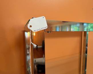 F5 - $750. Chrome and Glass Display Unit. Measures 76” x 12.25” x 60” tall.