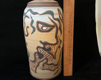 A157 - $65. Mary Wagner Potter "Dog and Man" on Clay Vase. Measures 5.5" x 12" tall. 