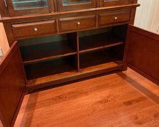F1 - $250. Lighted China Cabinet. Moves in 2 pieces. Measures 56“ x 18.5” x 81” tall.