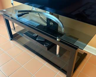 F4 - $50. Glass & Metal Media Stand. Measures 52” x 19.75” x 20.25” tall.