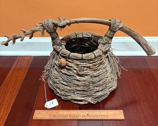 A19 - $60. Samuel Yao: Natural Woven Basket. Ann Arbor, MI. Measures 22" x 11.5" tall. 
