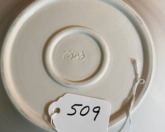 A509 - $30. Black & White Pottery Bowl. Signed MC3. Measures 11" x 3" tall. 