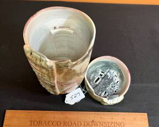 A527 - $55. Lidded Pottery Vessel. Measures 4" x 9" tall.