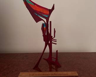 A142 - $100. Sabra Richards : Metal & Fused Art Glass Sculpture. Measures 10" x 6.5" x 16" tall. 