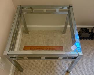 F10 - $125. Milo Baughman sytle Chrome & Glass Side Table. Measures 23.75"square x 20" tall. 