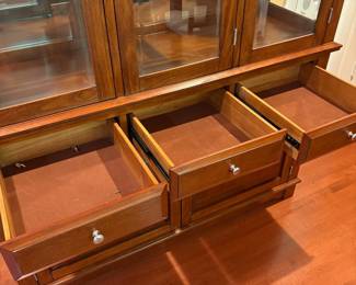 F1 - $250. Lighted China Cabinet. Moves in 2 pieces. Measures 56“ x 18.5” x 81” tall.