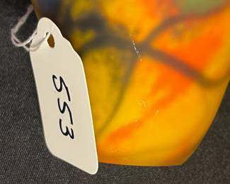 A553 - $35. Signed Art Glass Vase. Illegible. Measures 4" x 6" tall. 