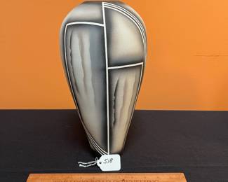 A518 - $35. Signed Sarah? Tall Black, White, Gray pottery vase. Measures 6" x 13" tall. 