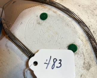 A483 - $25. Leather Looking Bowl - Arleen R Cohen. Was hanging outside - HAS CRACK