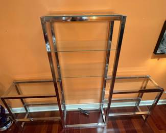 F5 - $750. Chrome and Glass Display Unit. Measures 76” x 12.25” x 60” tall.