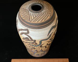 A157 - $65. Mary Wagner Potter "Dog and Man" on Clay Vase. Measures 5.5" x 12" tall. 