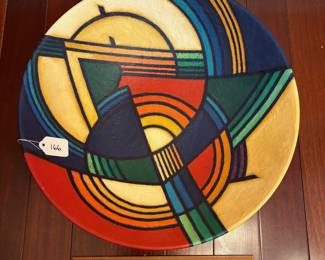 A166 - $200. Terry Habeger : Multi Colored Acrylic on Clay Plate. Measures 17.75" x 4.25" tall. 