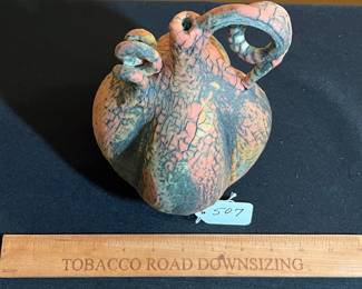 A507 - $250. Nicholas Bernard Pottery Vessel with Vine handle. Measures 5" x 9.5" tall. 
