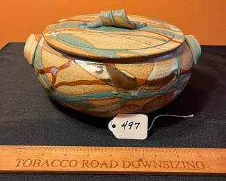 A497 - $30. Brown and Teal Lidded Casserole Dish - Signed - Illegible.  Measures 10" x 5" tall. 