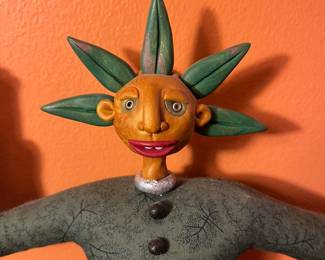 A106 - $100. TP Speer and Deborah Banyas: Set of Clay Dolls. Orange on measures 8" x 20.5" tall. Green one measures 9" x 25" tall. 
