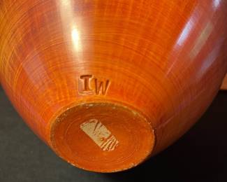A494 - $25. Orange with Black Rim Vessel signed - TW. Measures 8.5" x 5" tall. 