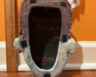 A285 - $250. Victoria Sexton "Remember Betrayal" Sculpture Clay. Measures 7" x 21". 