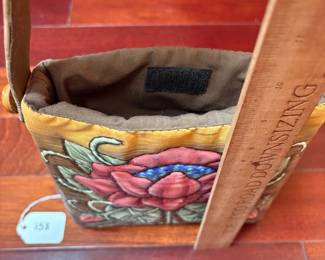 A158. $65. Roxanna Ahlborn : Fiber Graphics Purse. Measures 8" x 9" tall, 16.6" with handle.