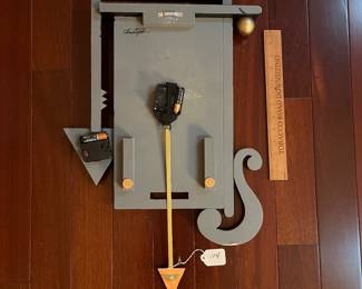 A114 - $55. Christopher Studio: Multicolor Clock. Measures 15.5" x 24.5".