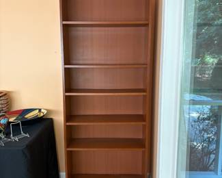 F6 - $40. Single Wooden Bookcase. Adjustable shelves. Measures 31.75” x 11” x 79.5” tall.