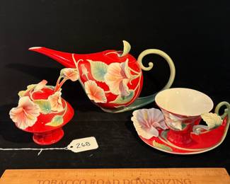 R268 - $200. Franz : Porcelain Hibiscus Collection Sugar, Creamer & Cup. Teapot measures 11.5" x 6" tall. 