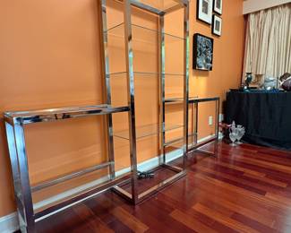 F5 - $750. Chrome and Glass Display Unit. Measures 76” x 12.25” x 60” tall.