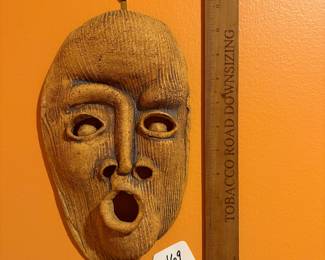 A469 - $40. Clay Mask by Barbara Haring. Measures 7" x 11.25". 