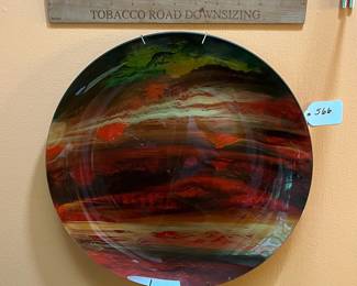 A566 - $40. Art Glass Wall Hanging Plate. Signed. Measures 13.25" round