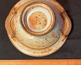 A492 - $25. Brown and Blue Footed Bowl With Handles. Unsigned. Measures 8.5" x 3" tall. 