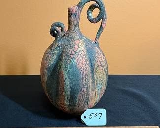 A507 - $250. Nicholas Bernard Pottery Vessel with Vine handle. Measures 5" x 9.5" tall. 