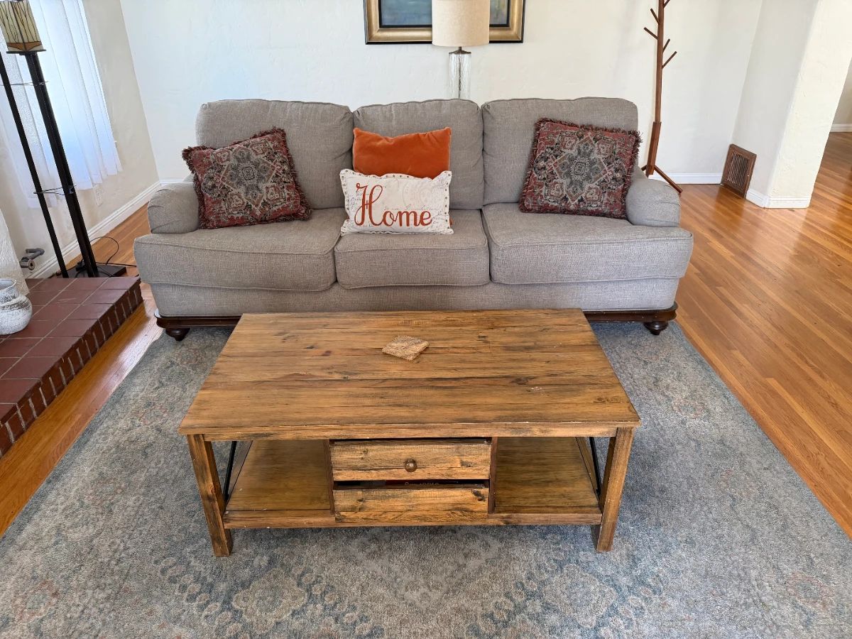 Sofa, chair, coffee table, rub, lamps, wall art