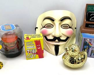 V For Vendetta Mask, Great Gays Mug, Disco Ball Duck, Wood Calendar & More Lot #: 123