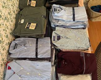 Lot of unused men’s clothing. Medium shirts, 36 waist chinos, pleated snd flat