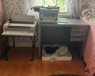 Vintage metal office desk and electric typewriters