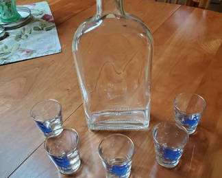 Lot 81: Bottle And Shot Glasses