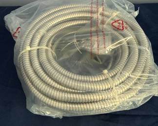 Lot 8: Coiled Metal Flexible hose and garden hands