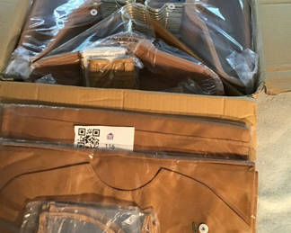 Lot 116: Clothes hangers and garment bags