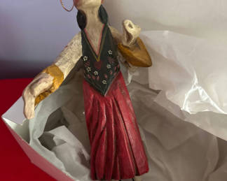 Lot 84: Hand-painted wooden folk-art figurine of a woman in a red dress with wings