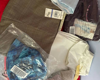 Lot 95: Assorted new clothing and textiles