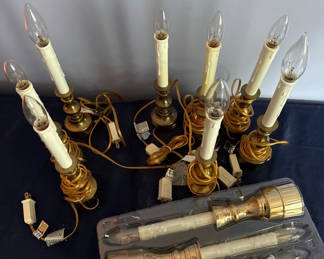 Lot 41: Brass candle-style electric lamps with spare parts