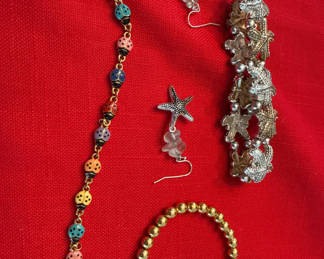 Lot 231: Multicolor Bead Necklace, Starfish Earrings, Nautical Charm Bracelet, and Gold Bead Bracelet