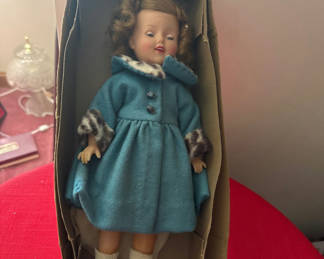 Lot 145: Shirley Temple Vintage fashion doll in blue coat in original packaging