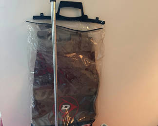 Lot 161: Golf travel bag, clubs, shoes, and training device